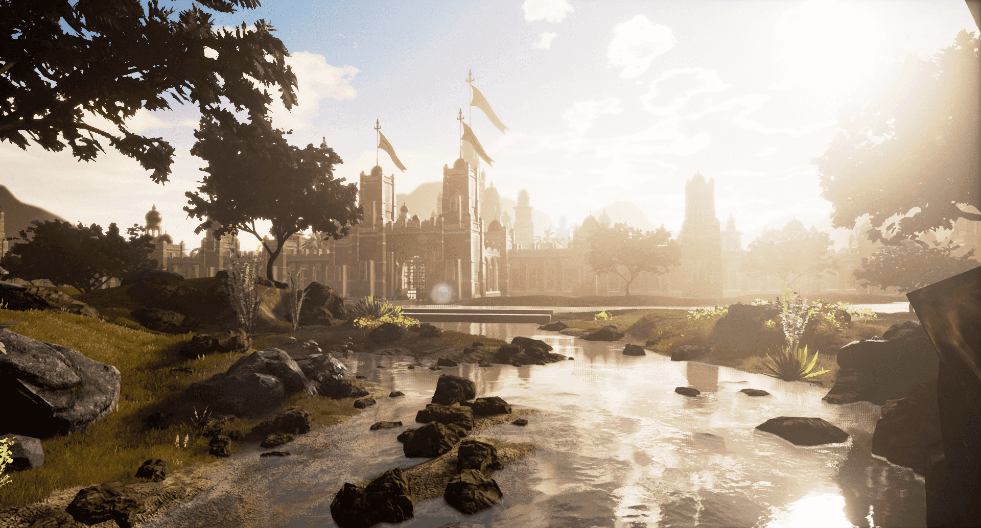 A river running through a grassy field with a castle in the background.