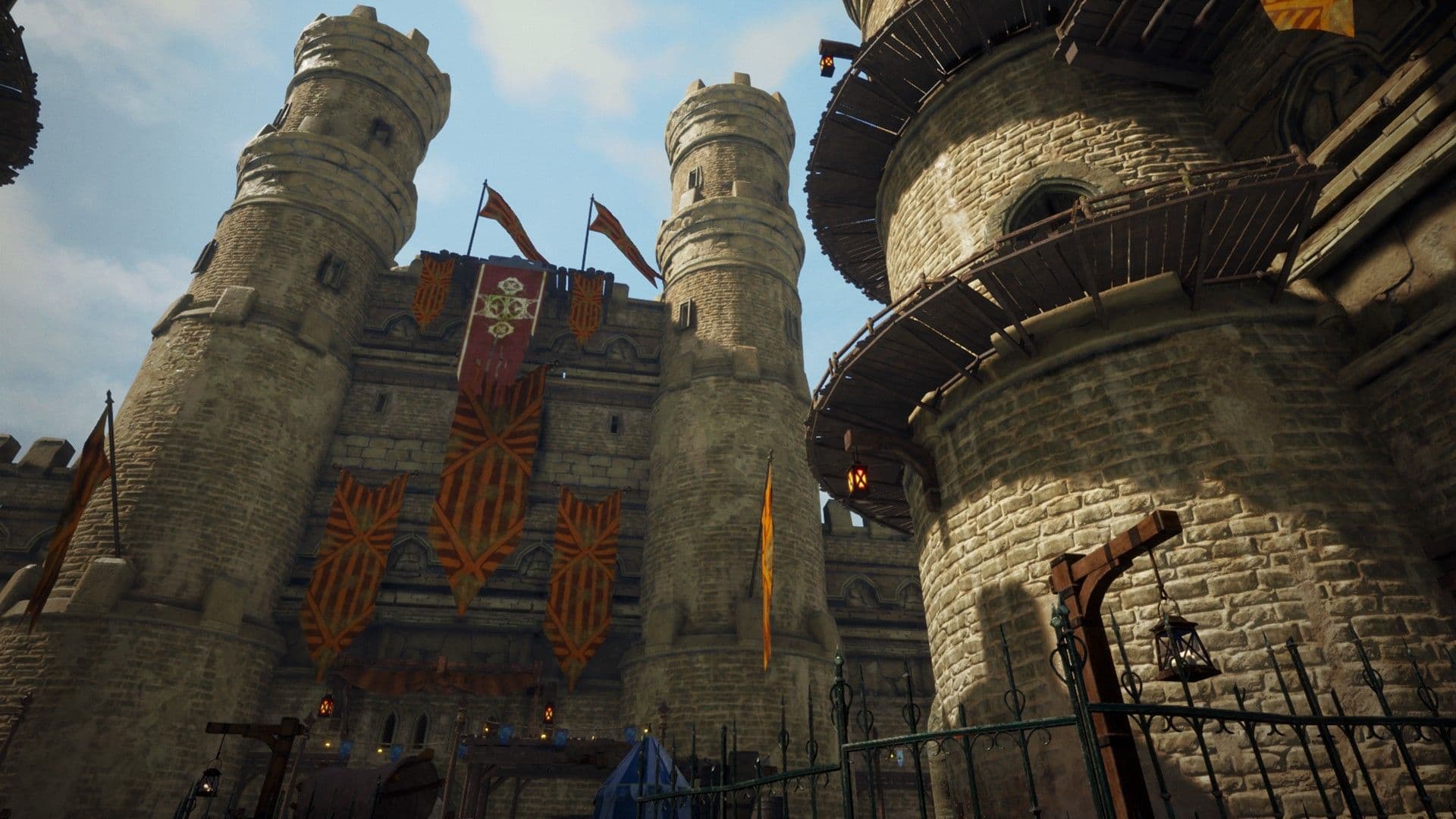 A view from outside of a giant stone castle with the camera facing up towards the peak of the towers.